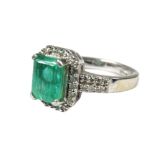 900 Platinum Ring set with a large Central Emerald of approx 2.16 cts and surrounded by Multiple Dia