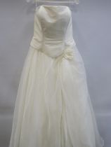 As New and unused Wedding dress or Ball gown. Back Zip and lace up. UK Size 12. See photos.