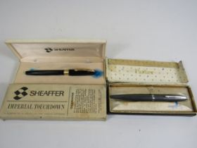 Shaffer imperial and Parker fountain pens with 14k gold nibs and original boxes.