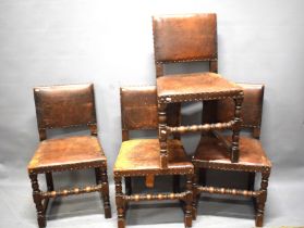 Four leather clad chairs with studwork. Bobbin turned stretchers. Possibly 19th Century. See phot