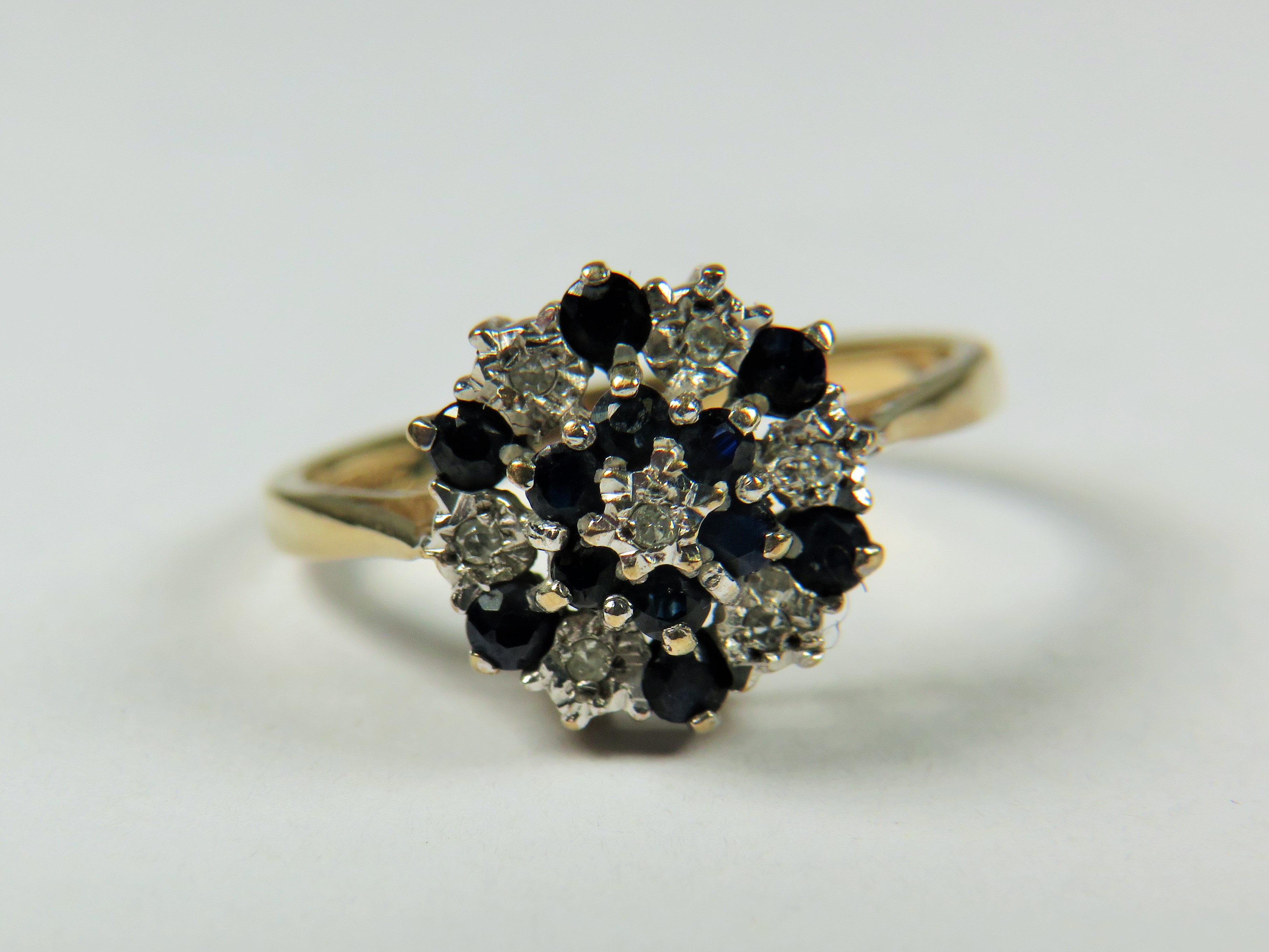 9ct Yellow Gold Diamond as Sapphire ring set in a Flower pattern.   Finger size 'M-5'   2.4g - Image 4 of 4