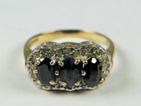 9ct Gold ring set with Triple Sapphires with Diamond surround. Finger size 'L-5' 3.2g
