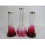 3 Antique glass vases with cranberry glass bases and silver rims.