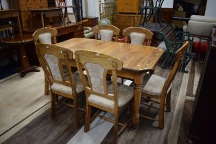 Dining table with six matching chairs in Oak. Good order. See photos. S2