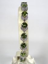 925 Silver Bracelet, 8 inches with detachable extension. Set with Synthetic Peridot & White Topaz as