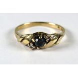9ct Yellow Gold Ring set in a twist pattern and set with a Central Sapphire flanked by Twin Diamonds