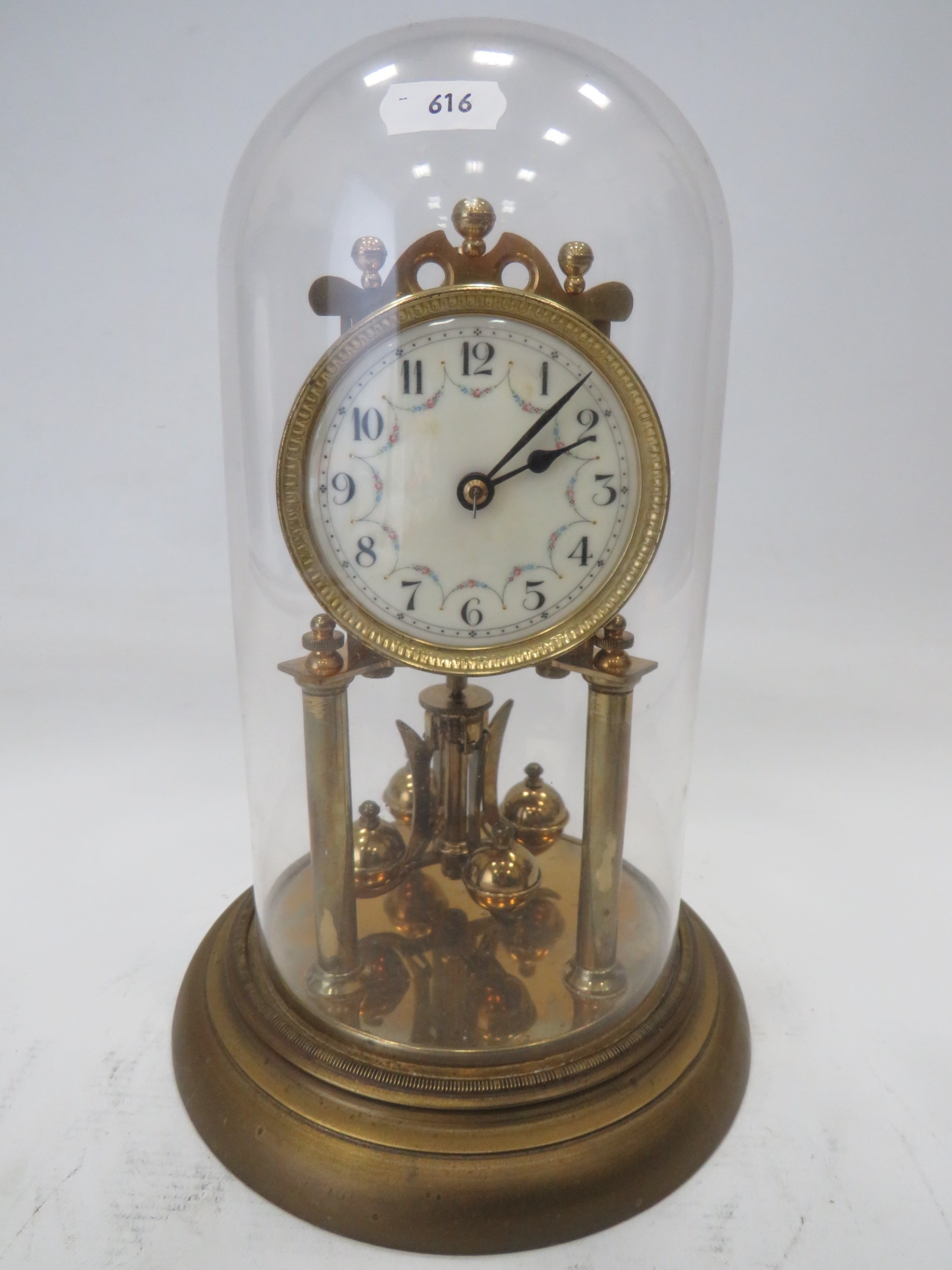 Brass Based Anniversary clock under a Glass Dome which measures approx 11 inches tall. Running order