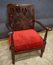 Fret work chair with red covering, 31" tall.