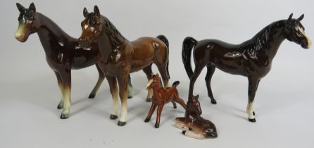 Selection of horse figurines including Beswick and West German.