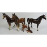 Selection of horse figurines including Beswick and West German.
