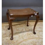 Handy sized Bergere topped footstool raised on tapered cabriole legs. H:18 x W:18 x D:13 Inches. See