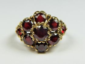 9ct Yellow Gold, Multi Garnet ring in a flower pattern. Finger size 'N' 6.1g