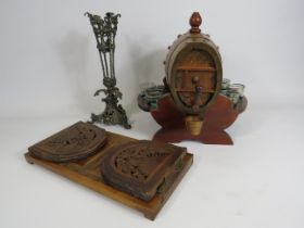 Vintage oak barrel liquor decanter, extending carved wood bookshelf and a epergne vase surround.