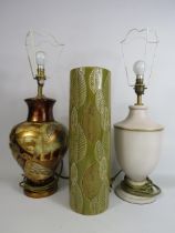 Two modern table lamps with shades and a floor vase.