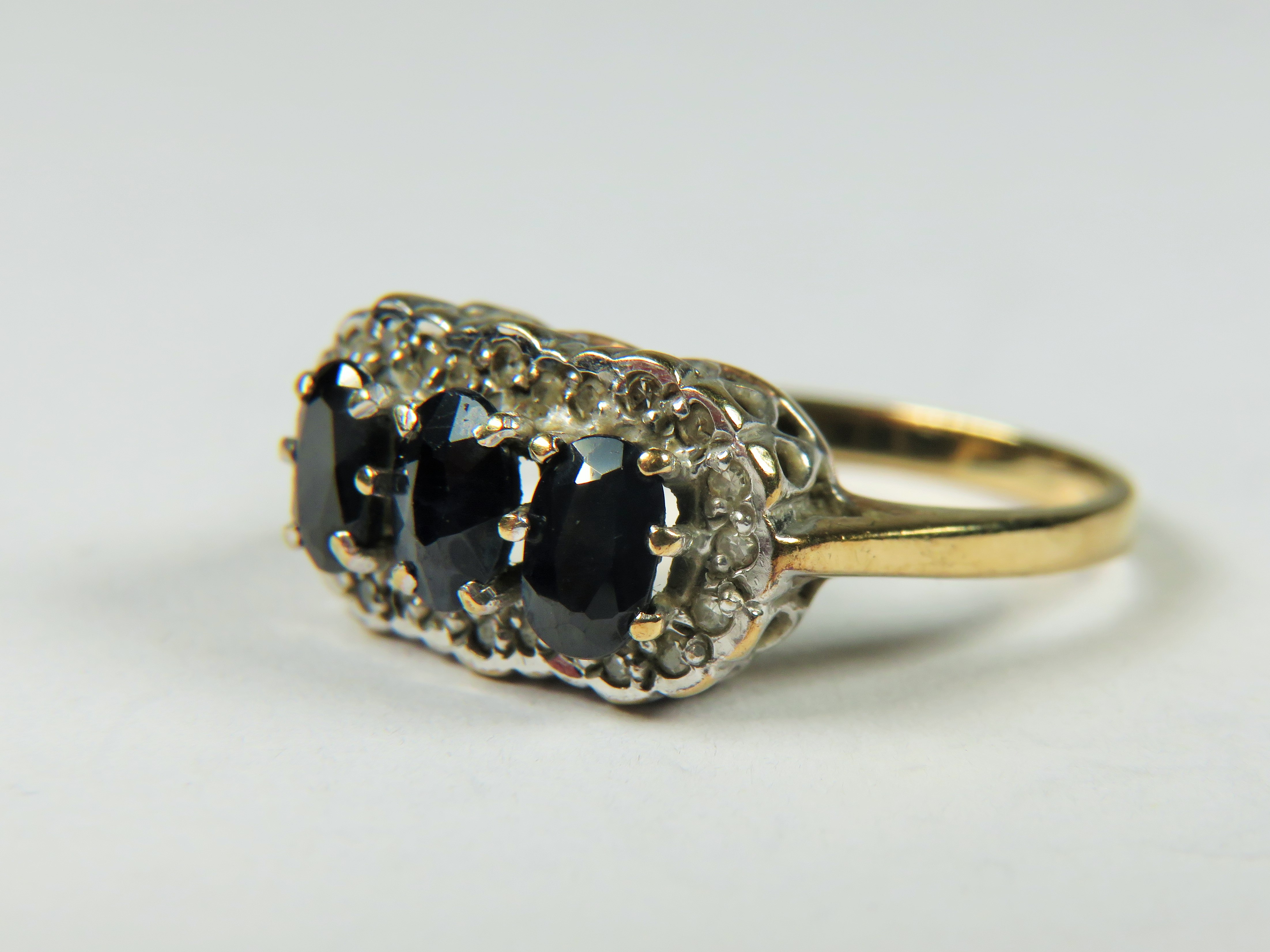 9ct Gold ring set with Triple Sapphires with Diamond surround.   Finger size 'L-5'  3.2g - Image 3 of 5