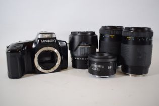 Minlota dynax 5000 SLR Camera body with Four lens.  See photo for details. 