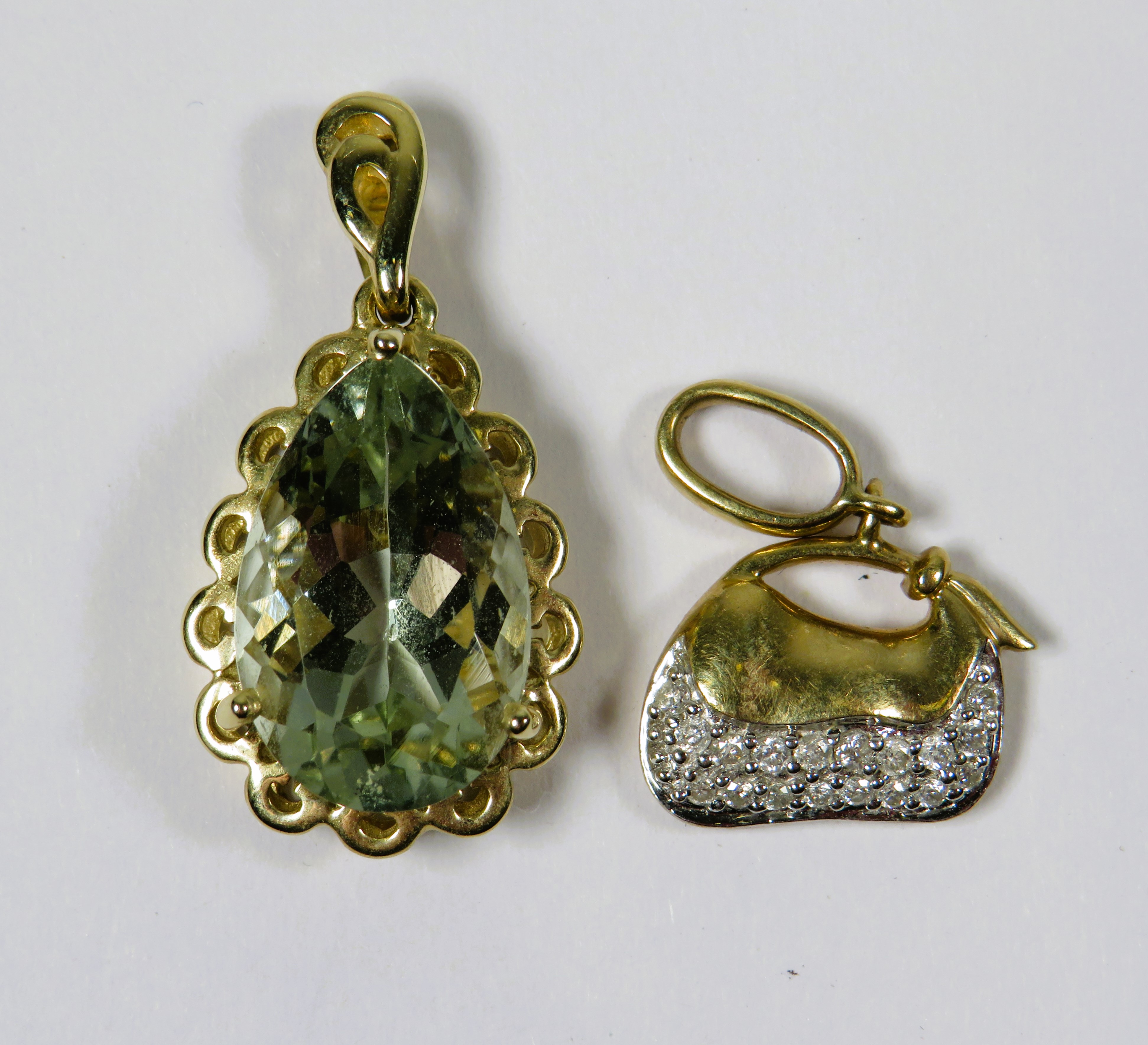 Two Very Pretty 9ct Gold Pendants,  One a quartz set teardrop shaped which measures 21mm, the other 