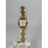 Ladies Accurist 21 Jewel Swiss made watch with 9ct Gold Case and Strap.. Total weight 12.1g