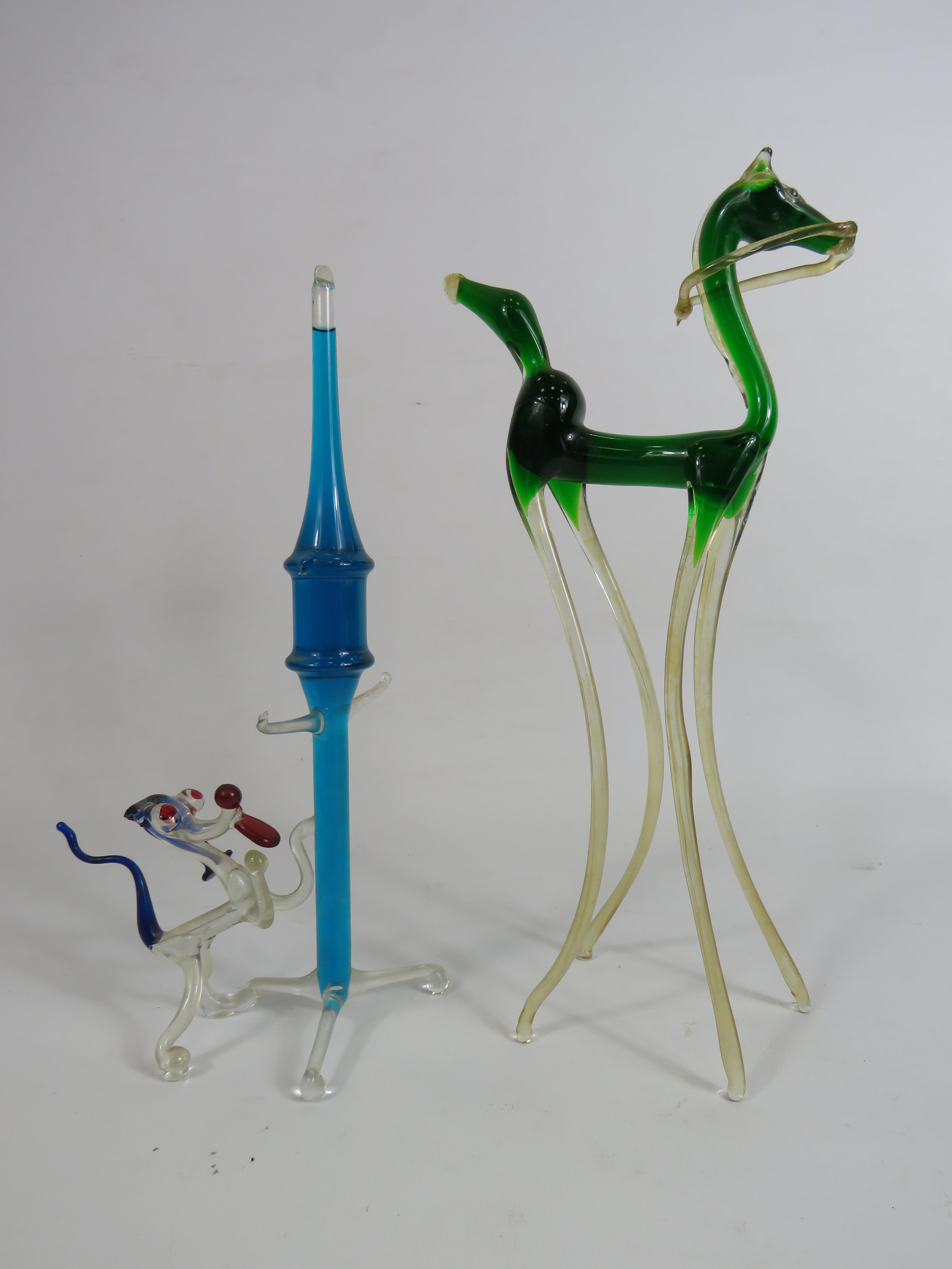 Two large art glass figures filled with liquid, the tallest stands 29cm.