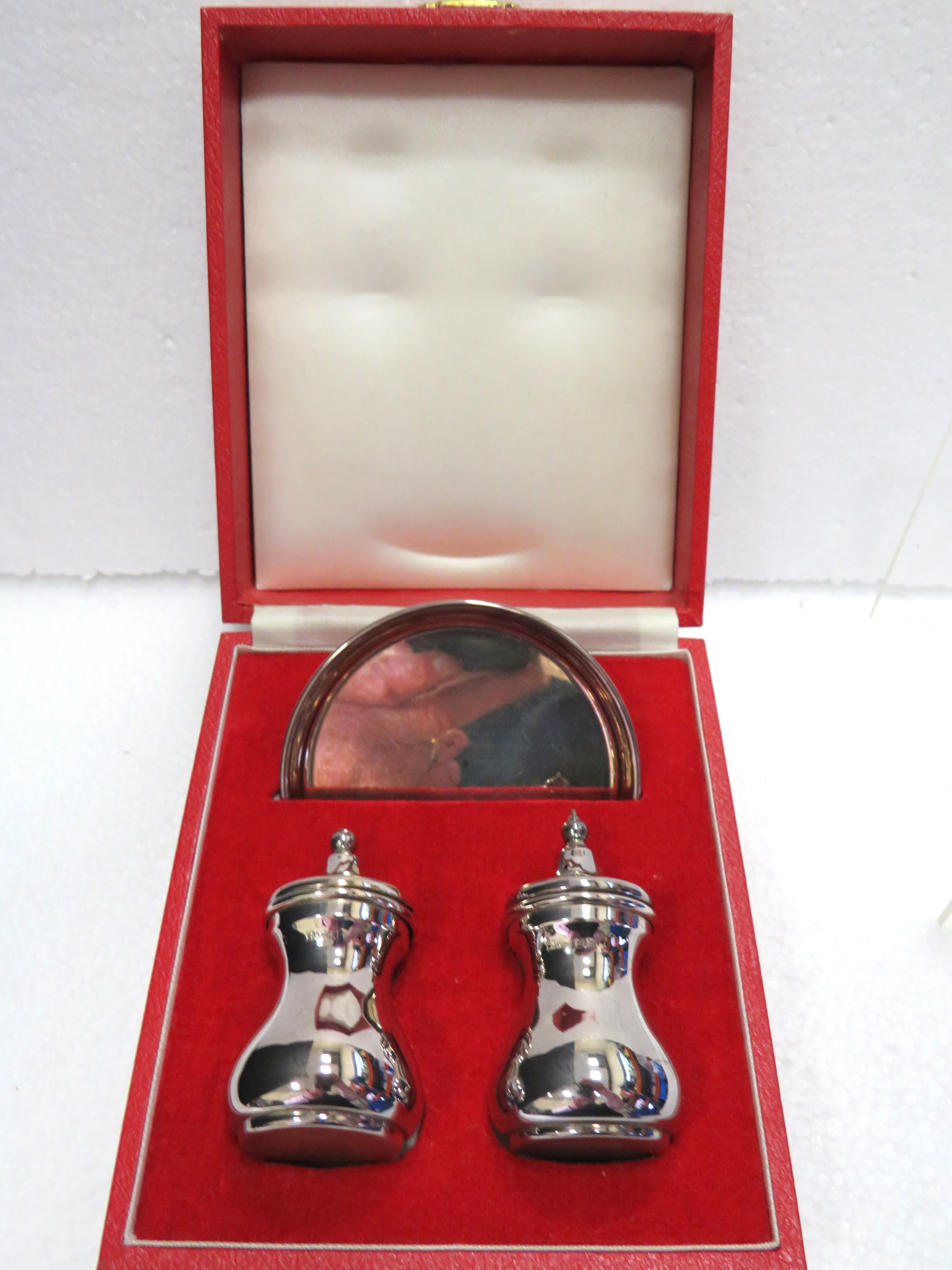 Silver Boxed presentation set of a pair of cruets and a small silver Salver.  Total Silver weight 10