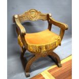 Oak X framed chair with lots of carved decoration. Armorial crest to splat..See photos. S2