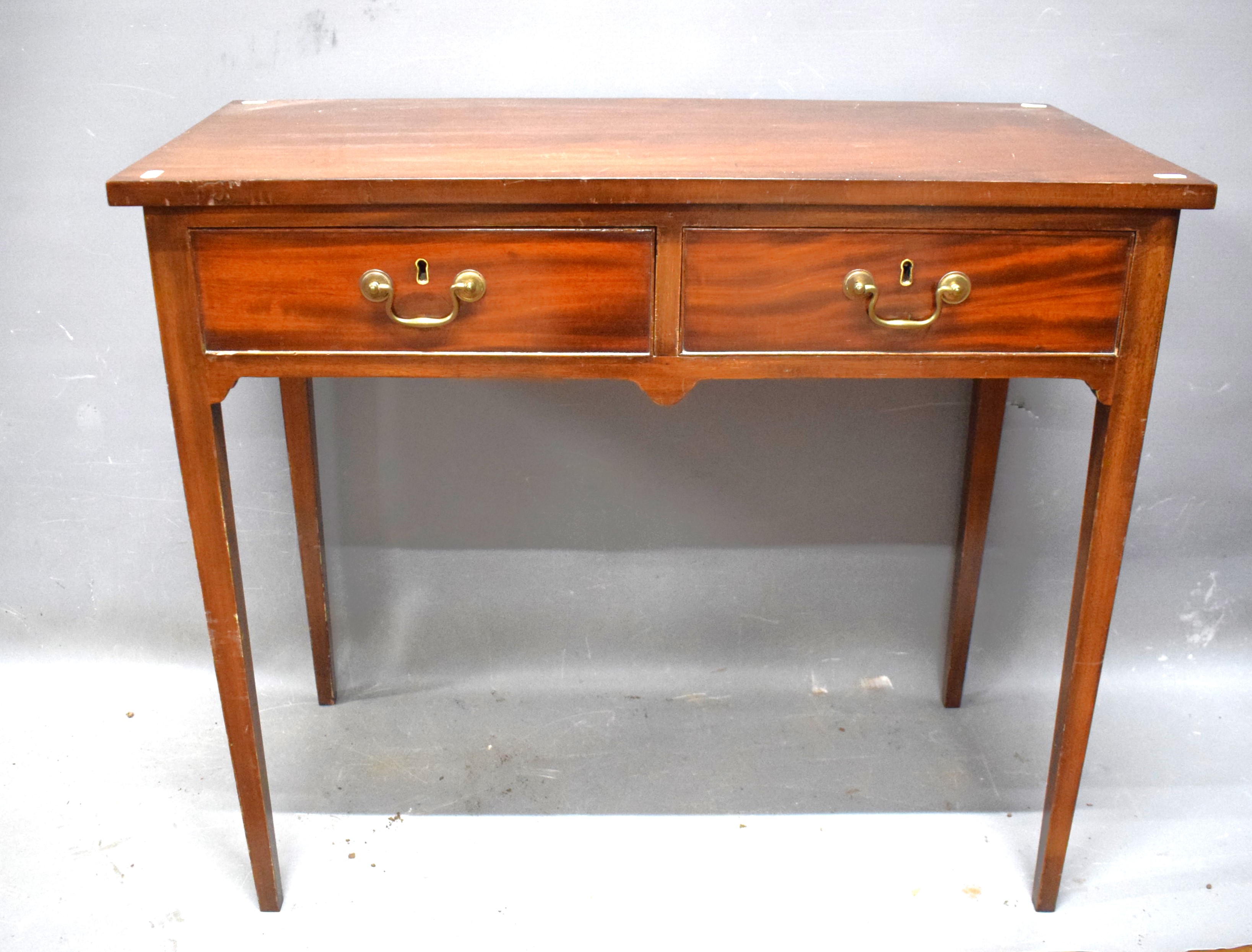 Mahogany Side table with two drawers .  Raised on tapered legs it measures approx 29 inches tall.   