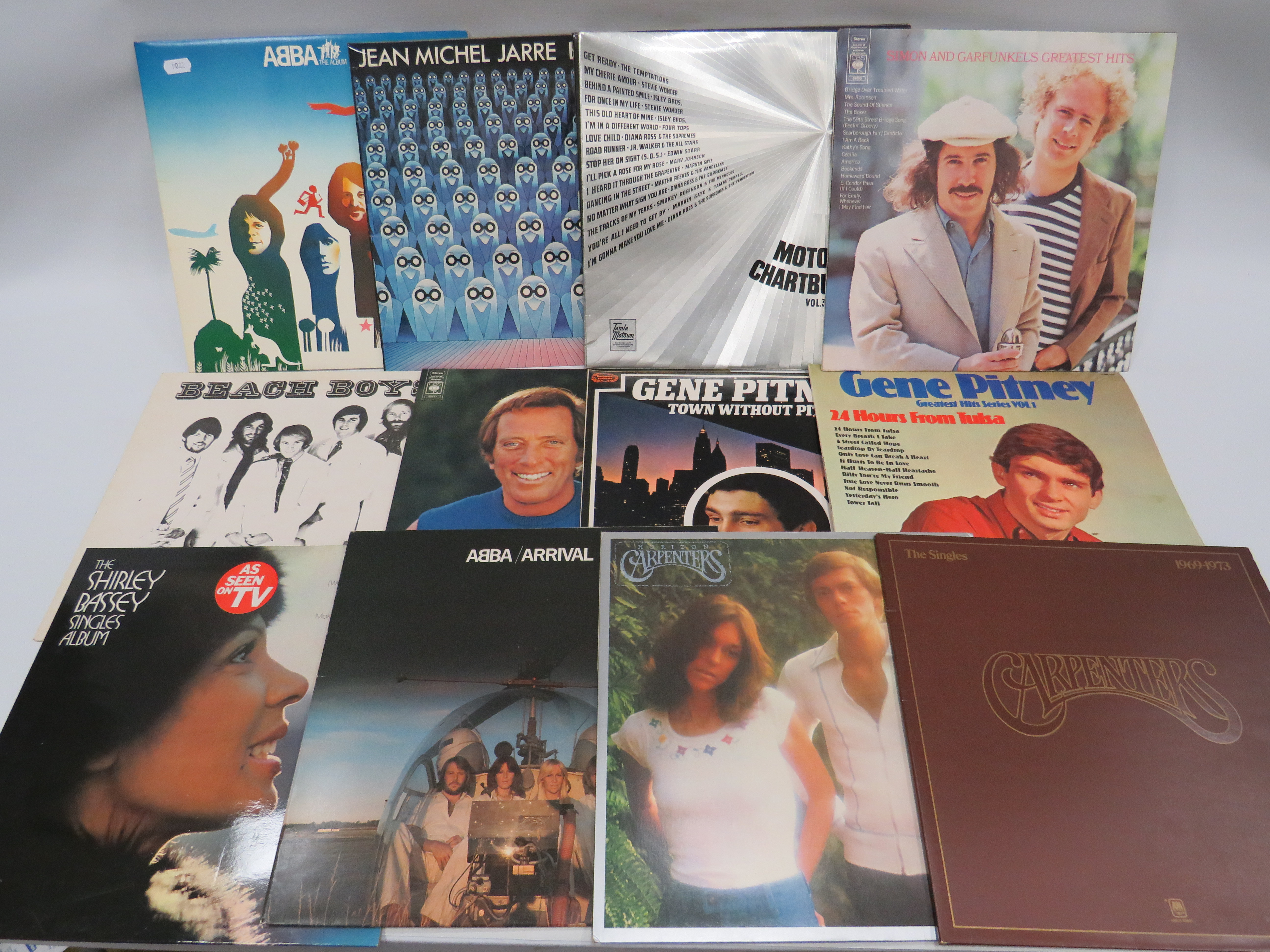 Twelve Vinyl Rock & Pop LP's to include Abba, Jean Michel Jarre. See photos. 