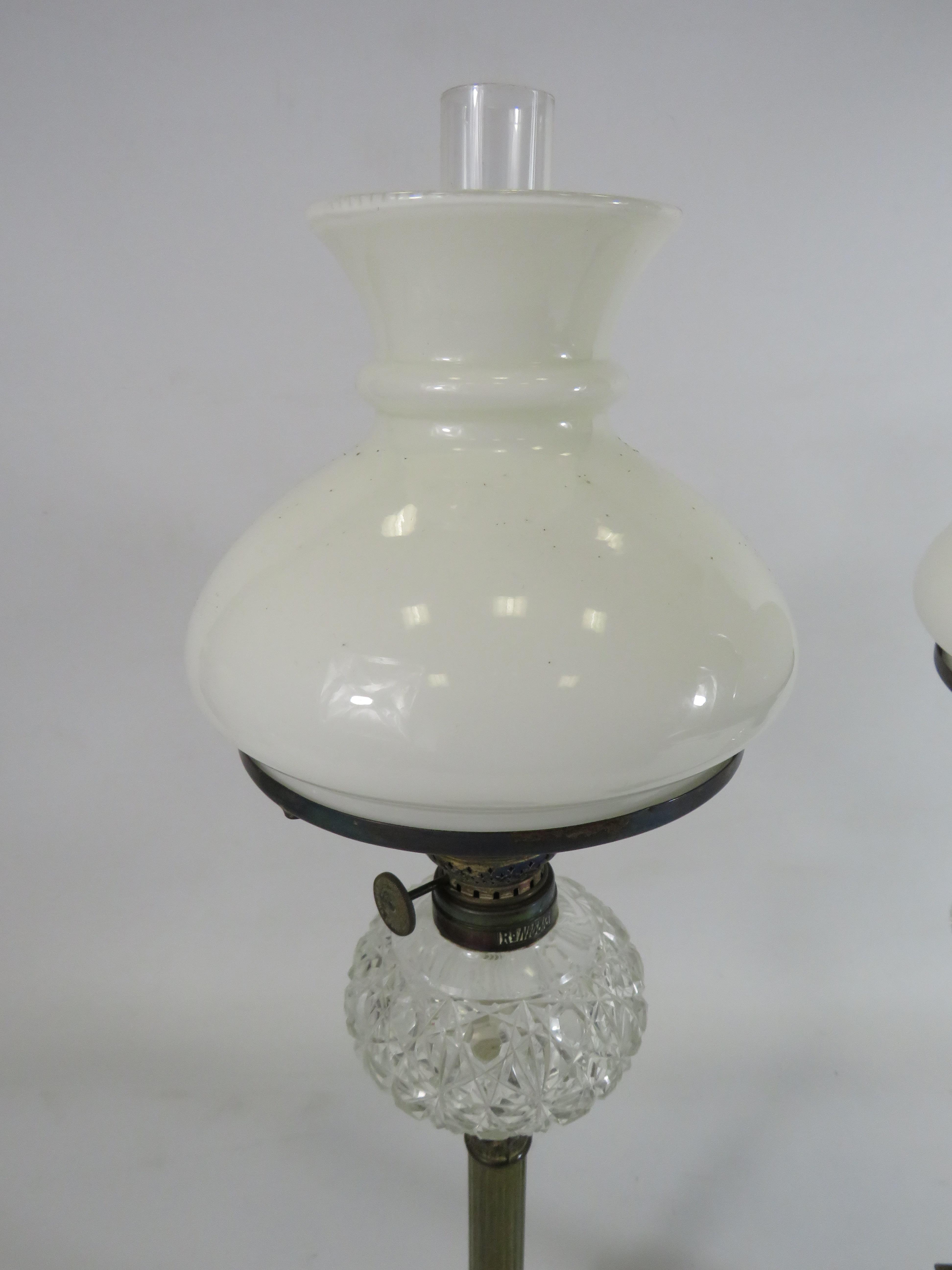 Two vintage brass oil lamps with column bases and crystal glass reserve, approx 21" tall. - Image 4 of 4