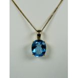 Topaz Set 14ct Yellow Gold pendant supported on an 17 inch 9ct Chain. Topaz measures approx 12 x 10m