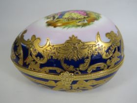Roselle OCC & Co Staffordshire large ceramic egg, 23cm long 14cm tall and 15cm wide.