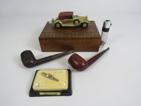 Vintage wooden trinket box with diecast car to the top, 2 Tobbaco pipes etc.