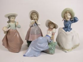 4 Nao figurines of girls with birds and flowers, the tallest stands 21cm. (one is missing a hand see