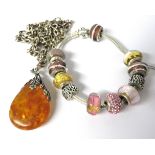 925 Silver set faux Amber pendant set on a long 24 inch silver gypsy link chain together with a Pand