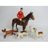 Beswick Huntsman on a bay horse, 3 Hounds and a fox. (one hound has a repair to the tail)