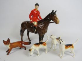 Beswick Huntsman on a bay horse, 3 Hounds and a fox. (one hound has a repair to the tail)