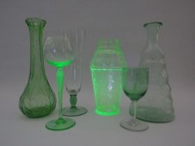 Selection of Uranium glass to include bottles, vase and glasses.