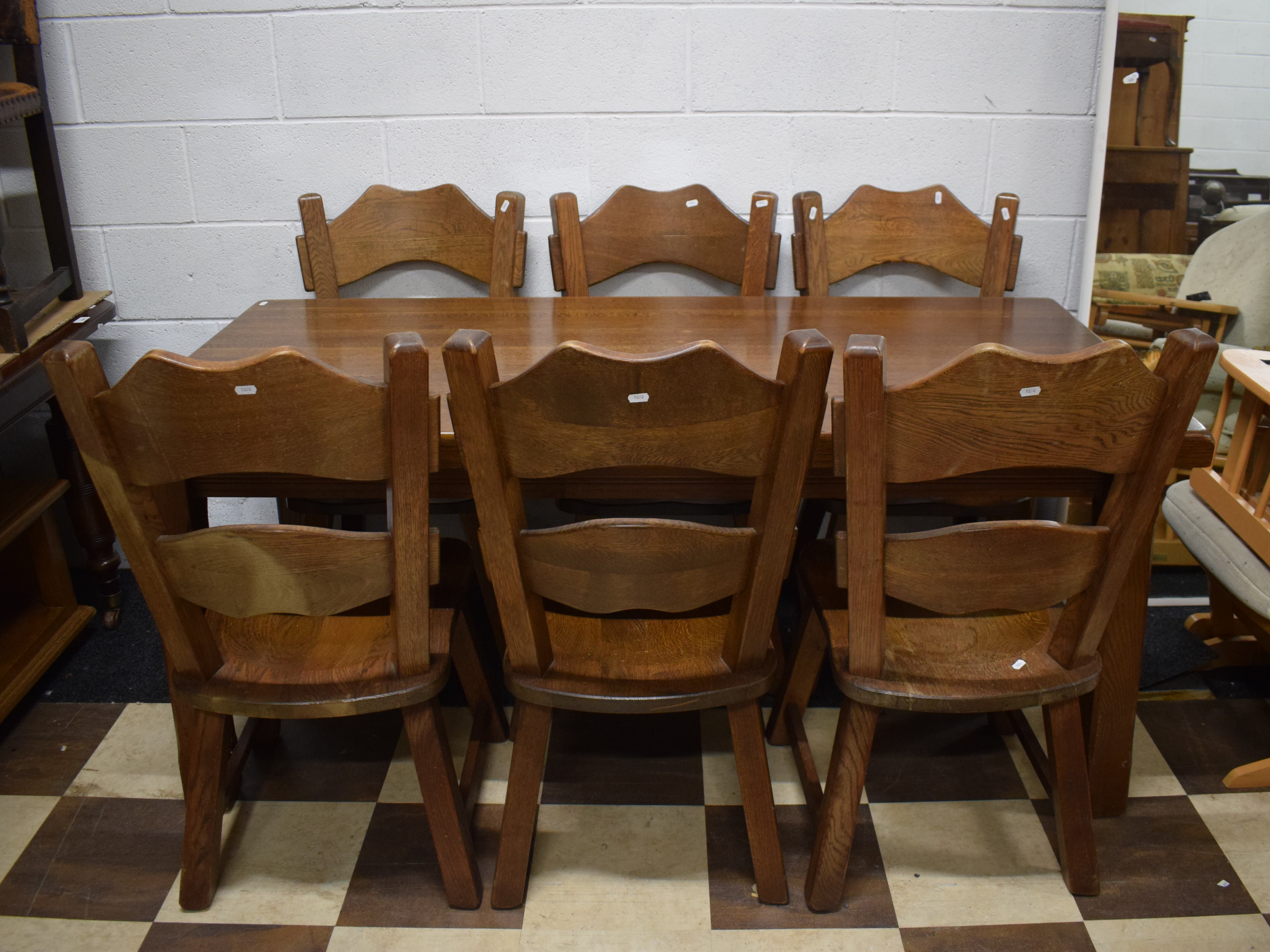 Very Heavy and Solid Oak Dining Table with Six chairs of interesting shape and construction.  See ph