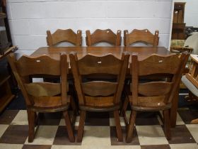 Very Heavy and Solid Oak Dining Table with Six chairs of interesting shape and construction. See ph