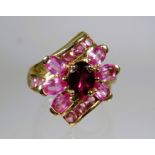 9ct Yellow Gold Ring set with Pink Tourmaline in a flower pattern.   Finger size 'M'    4.5g