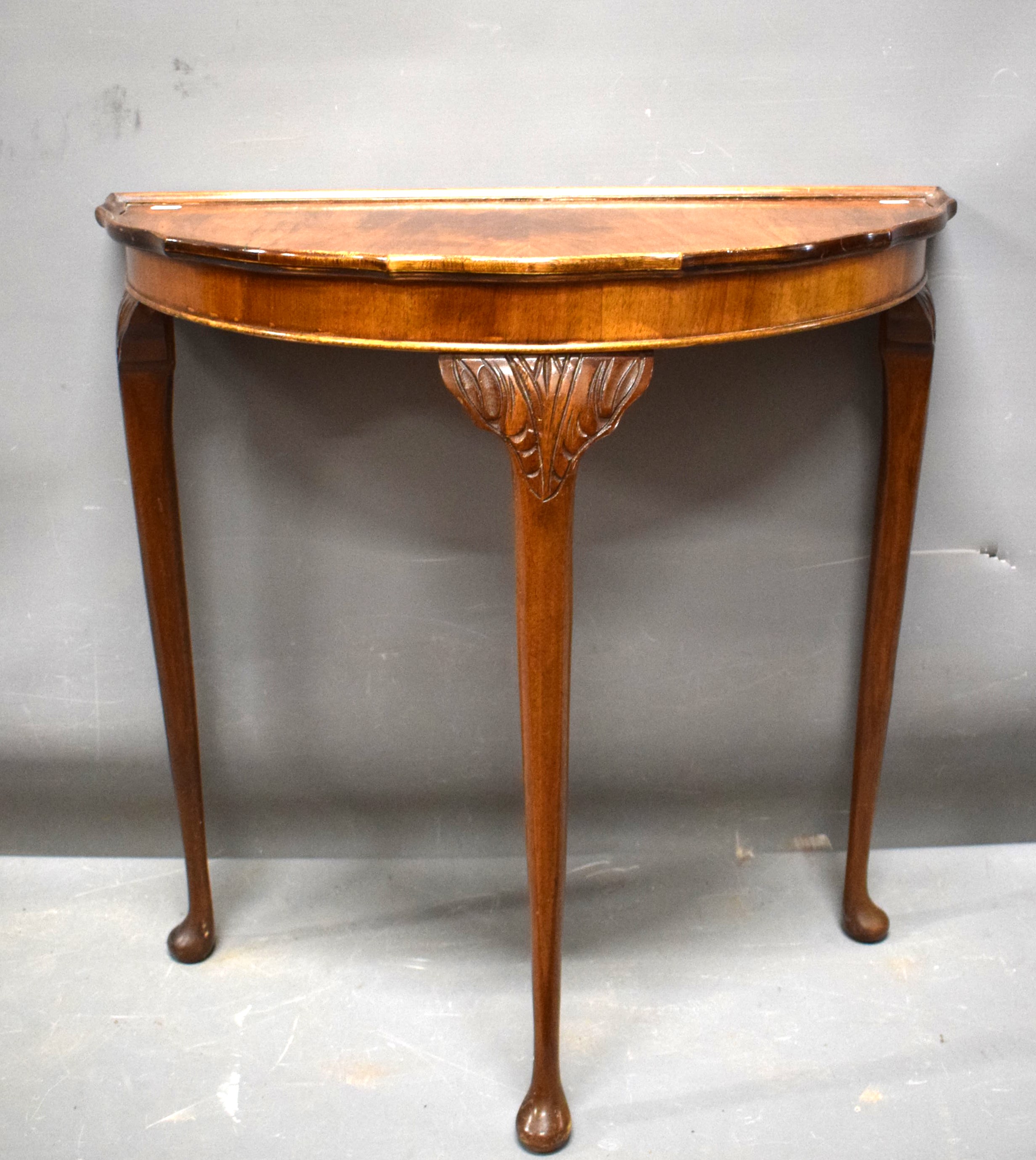 Attractive Demilune hallway or console table  raised on three carved topped elegant legs it measures