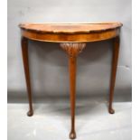 Attractive Demilune hallway or console table  raised on three carved topped elegant legs it measures