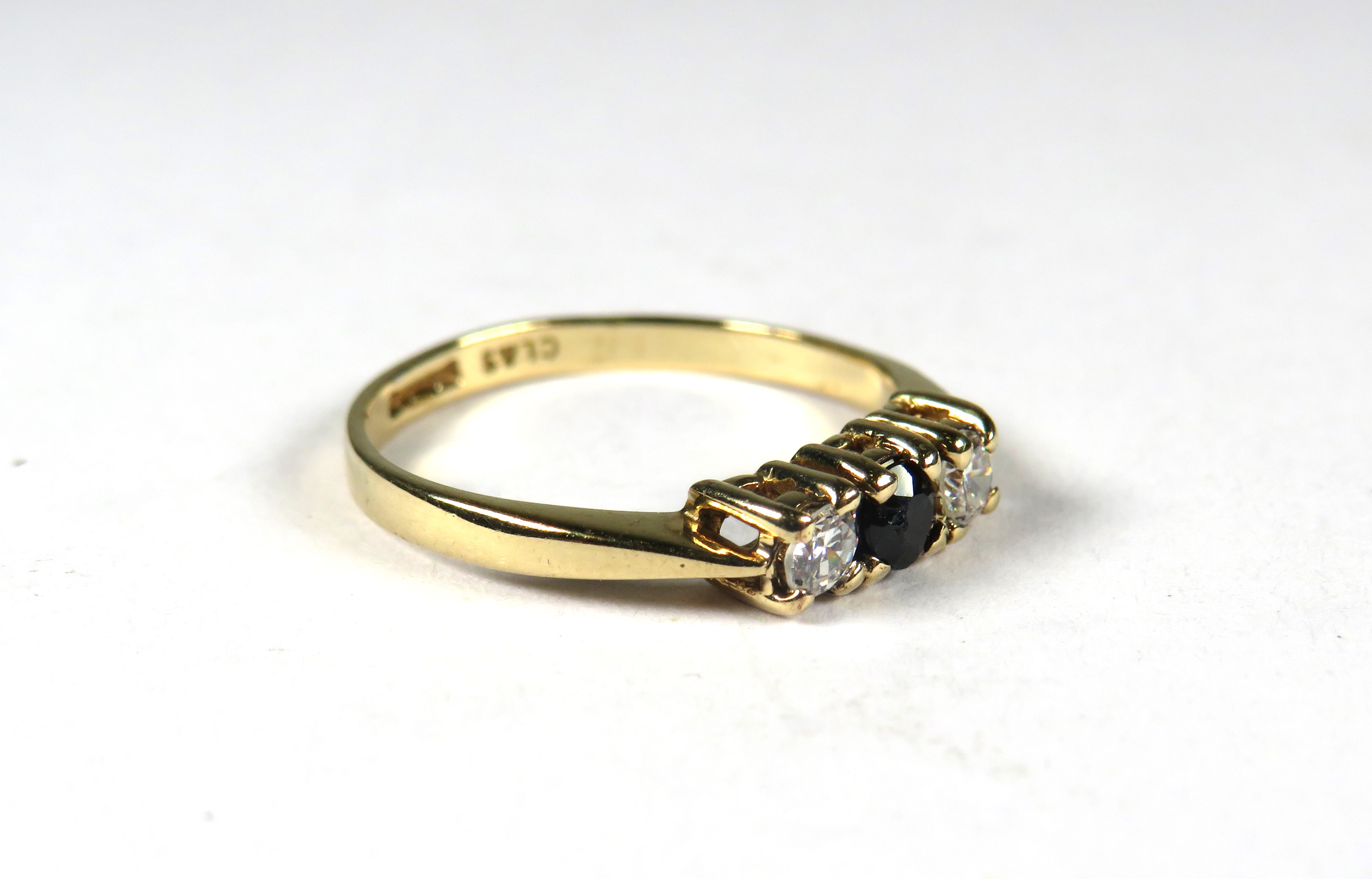 9ct Yellow Gold ring set with a small Central Sapphire Flanked by CZ.  Finger size 'K'    1.3g - Image 2 of 3