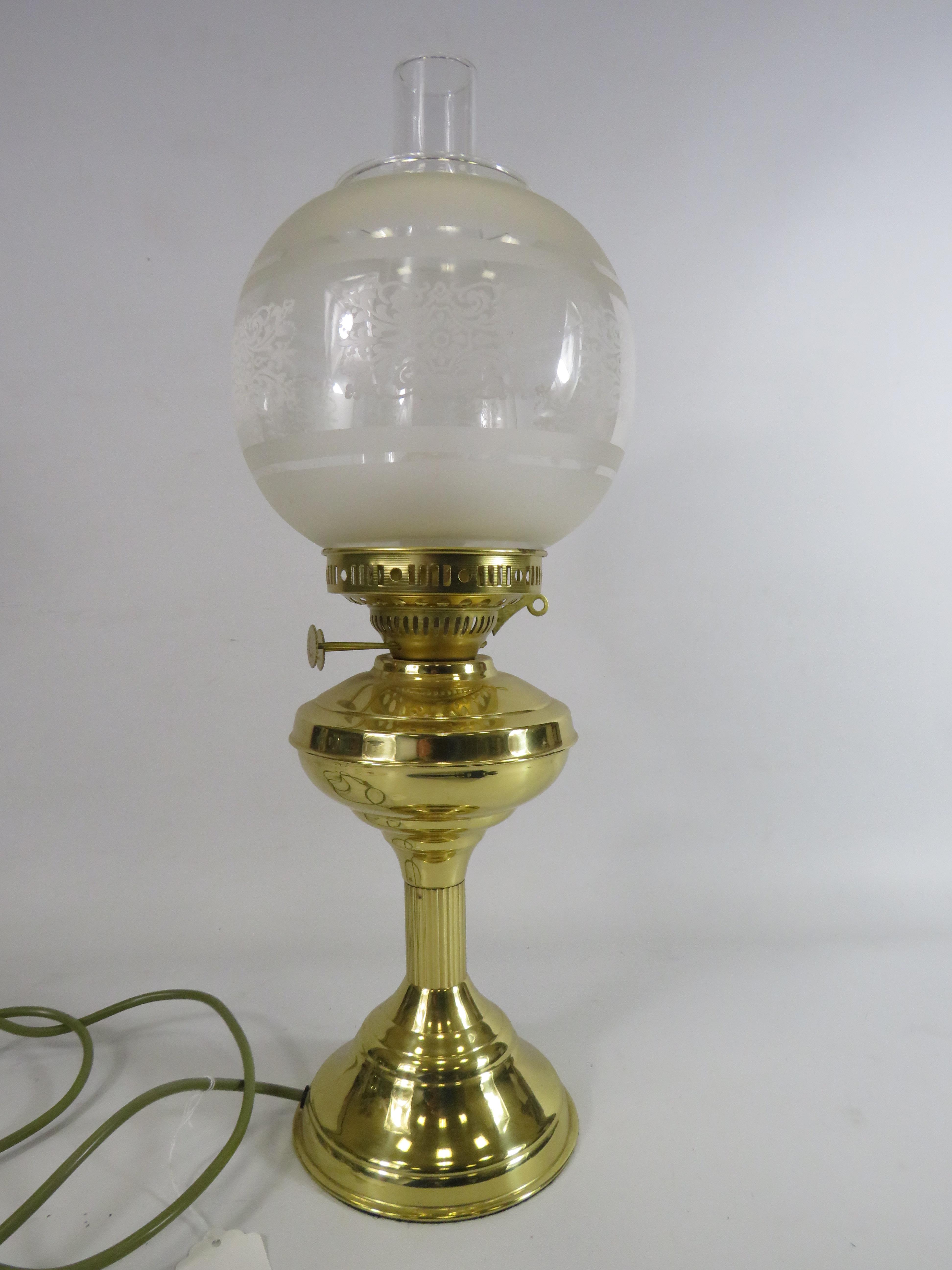 Nanticalia oil lamp converted to electric with globe shade.