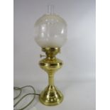 Nanticalia oil lamp converted to electric with globe shade.