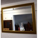 Large Bevelled glass mirror in fancy gilt frame.   36 x 44 inches. See photos.   S2