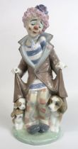 Lladro figurine of a clown with dogs hiding under his coat, model no 5901, approx 25cm tall. With