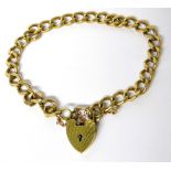 9ct Yellow Gold Flat link Bracelet with safety chain fitted. Heart Padlock clasp. 7 inches long .  W