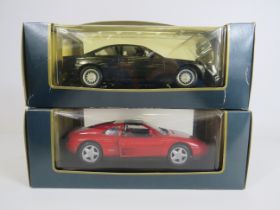 2 Maisto 1:18 scale diecast cars, BMW850i and a Ferrai 348-TS both boxed.