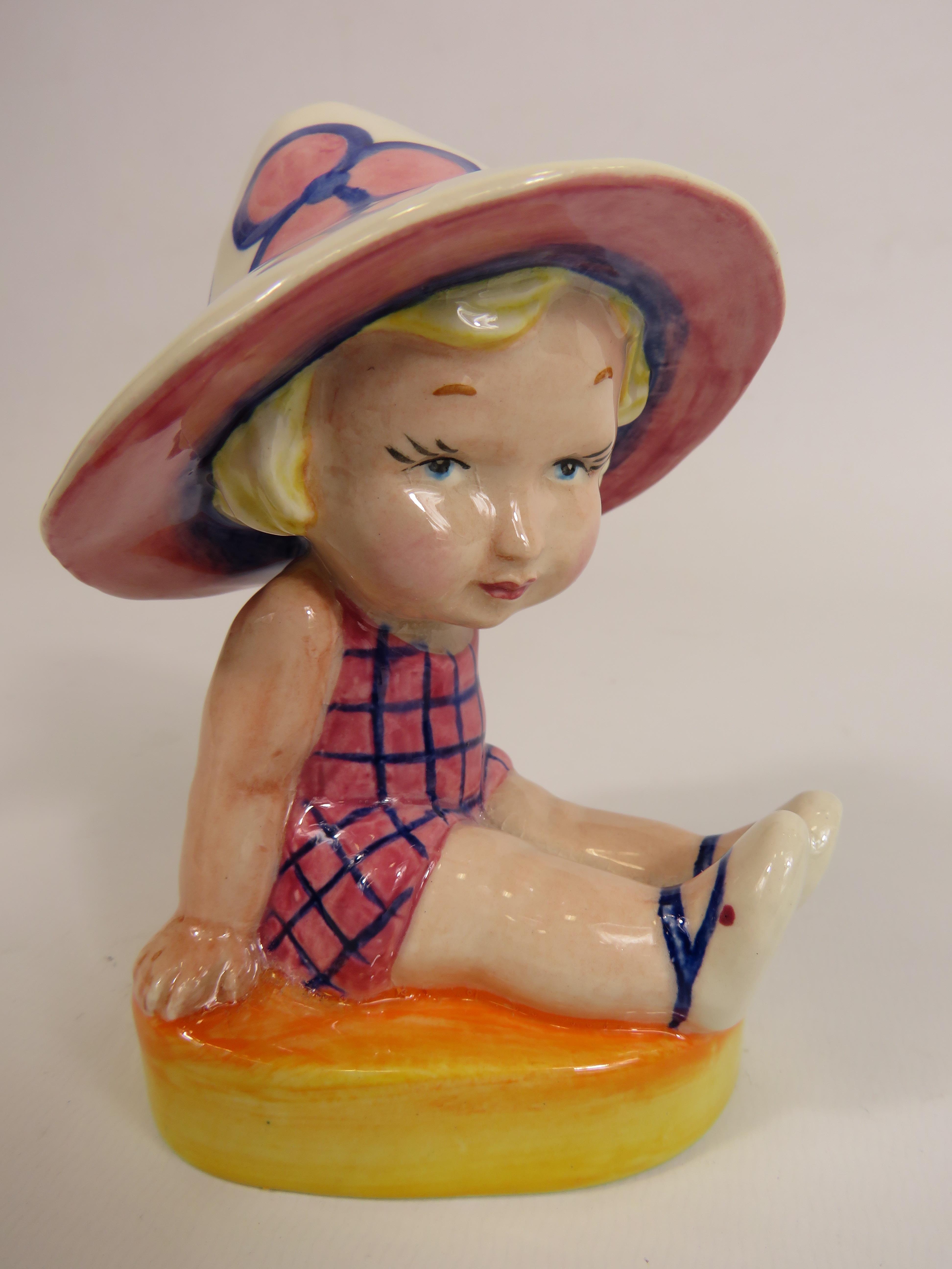 Lorna Bailey Art deco style figurine No 1 of 1, little girl seated wearing a sun hat. 13cm tall.