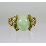 9ct Yellow Gold Ring set with an Oval Jade  (10 x 8mm) with Diamond and white Sapphire to each Shoul